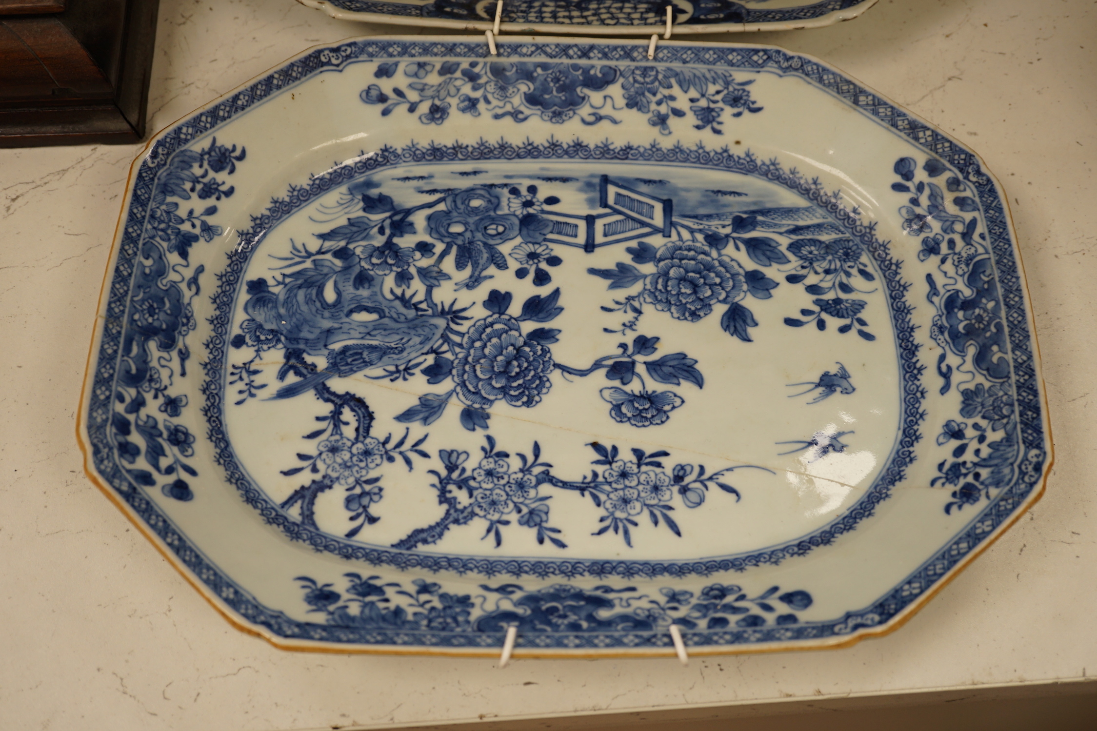 Three 18th century Chinese blue and white meat plates, largest, 41.5cm wide, 35cm deep (a.f.)